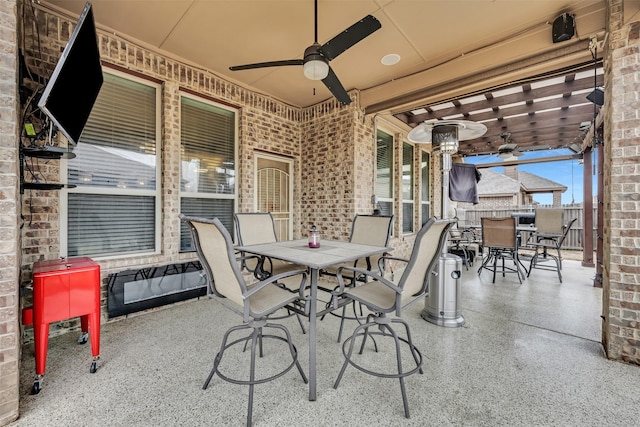 view of patio featuring ceiling fan and a pergola