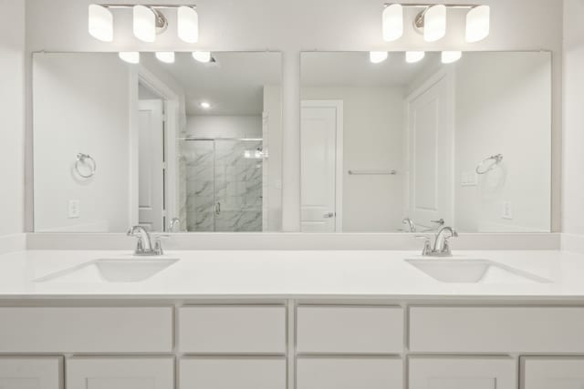 bathroom featuring vanity and a shower with shower door