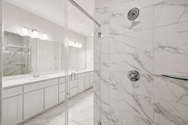 bathroom featuring vanity and an enclosed shower