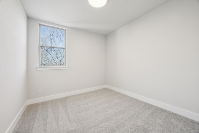 unfurnished room featuring carpet