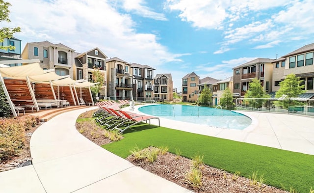 view of pool featuring a yard