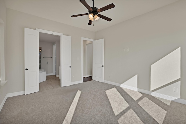 unfurnished bedroom with ceiling fan and light colored carpet