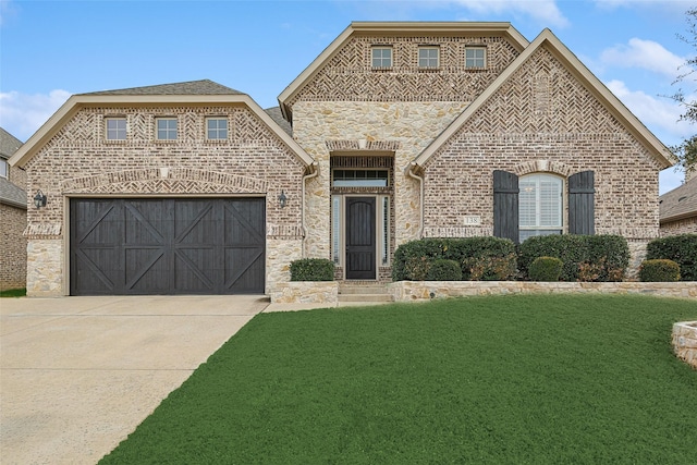 view of front of property with a garage and a front yard