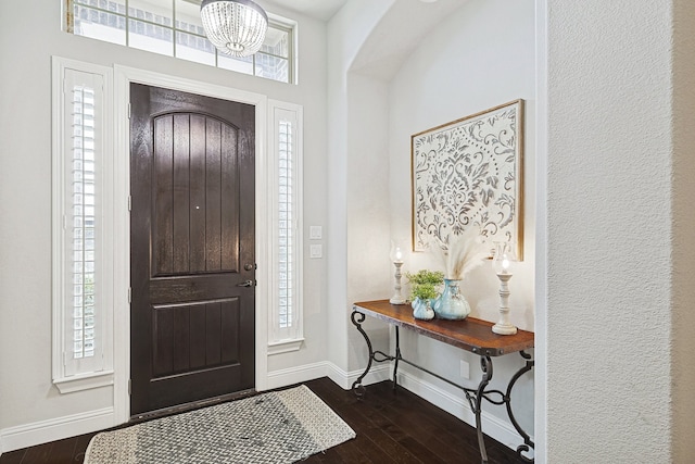 entrance foyer with dark hardwood / wood-style floors