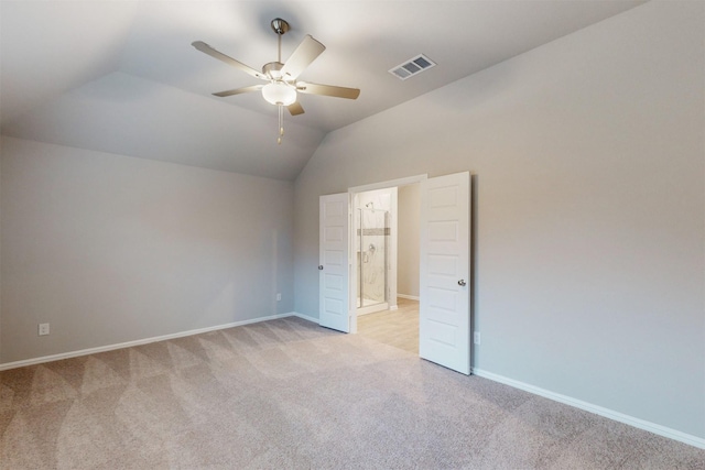 unfurnished bedroom featuring ceiling fan, light colored carpet, and lofted ceiling