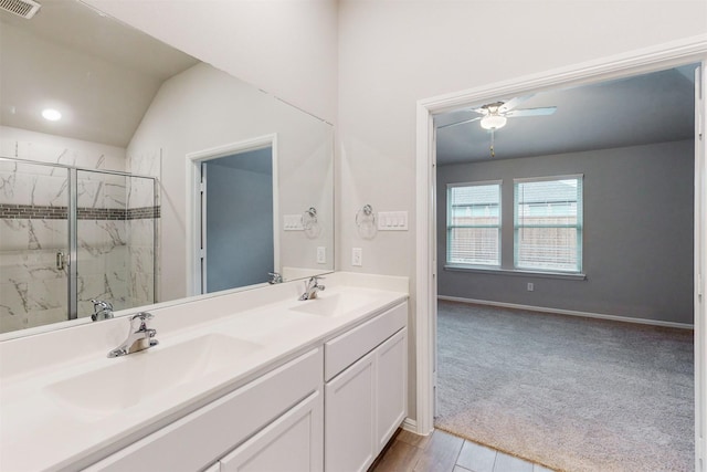 bathroom featuring vanity, ceiling fan, and walk in shower