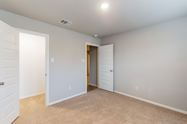 unfurnished bedroom with light carpet