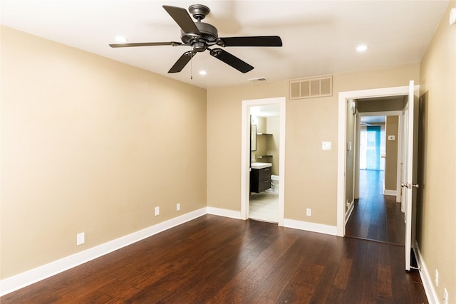 unfurnished bedroom featuring ceiling fan and dark hardwood / wood-style flooring