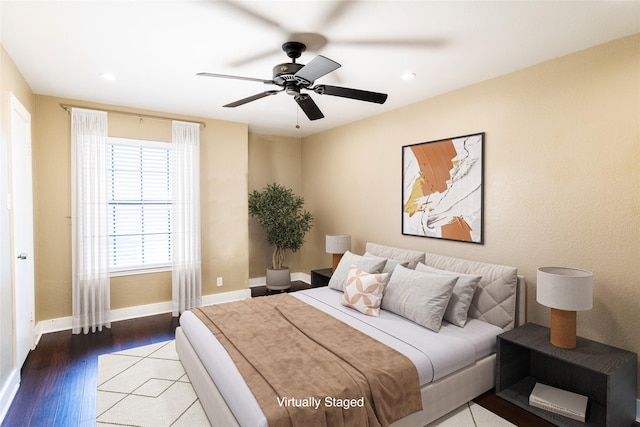 bedroom with hardwood / wood-style flooring and ceiling fan