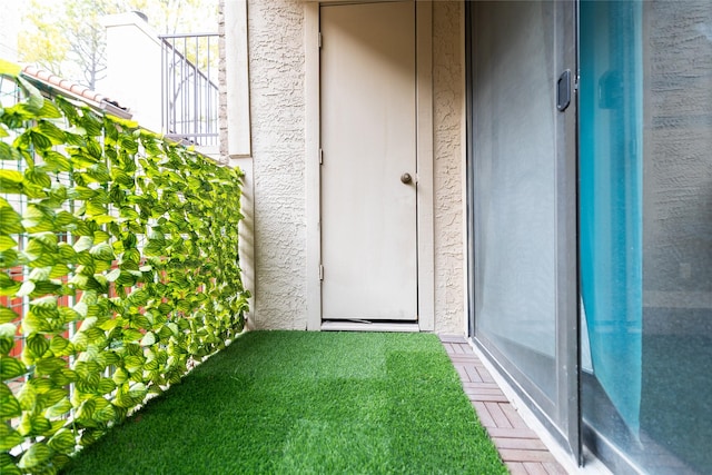 entrance to property with a balcony