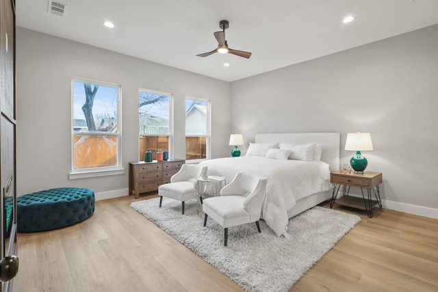 bedroom with recessed lighting, visible vents, light wood-style flooring, and baseboards