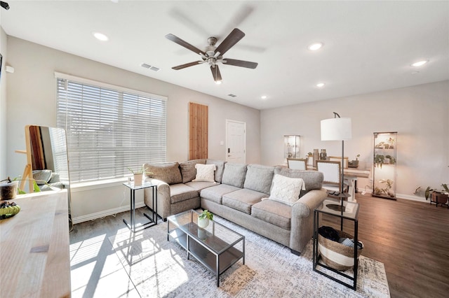 living room featuring hardwood / wood-style flooring and ceiling fan