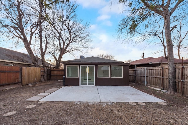 back of property featuring a patio