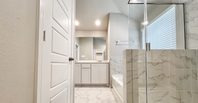 full bath with marble finish floor, a garden tub, a marble finish shower, a textured wall, and vanity