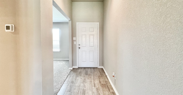 hallway with light wood-type flooring