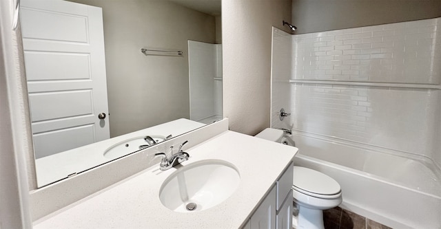 bathroom with toilet, tub / shower combination, and vanity