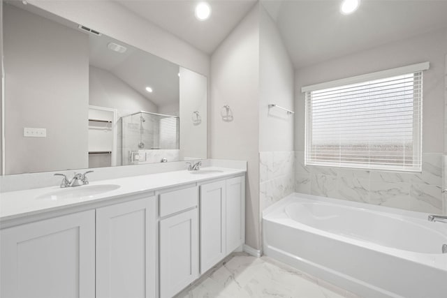 full bathroom with a bath, marble finish floor, a shower stall, and a sink