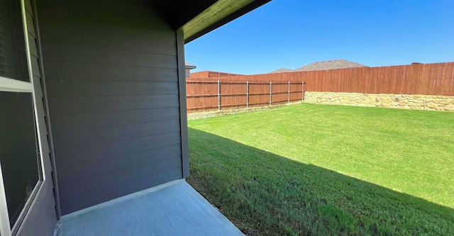 view of yard with a fenced backyard