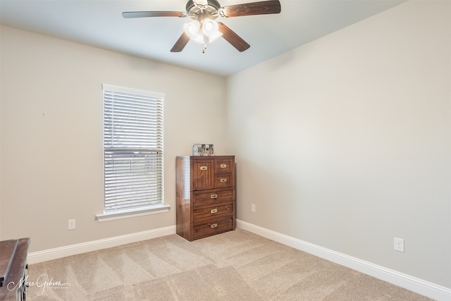 bedroom with ceiling fan and light colored carpet