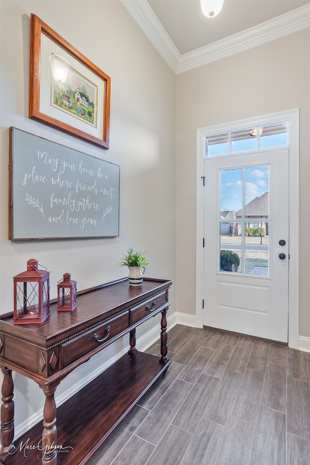 foyer featuring crown molding