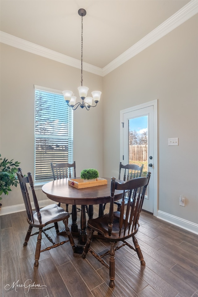 dining room featuring crown molding, a notable chandelier, and dark hardwood / wood-style flooring