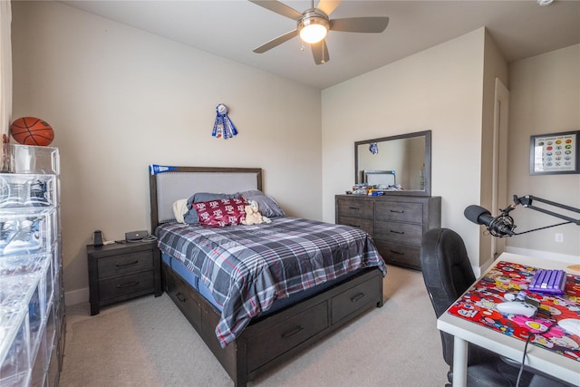 bedroom featuring light colored carpet and ceiling fan