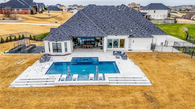 view of pool featuring a patio and a lawn