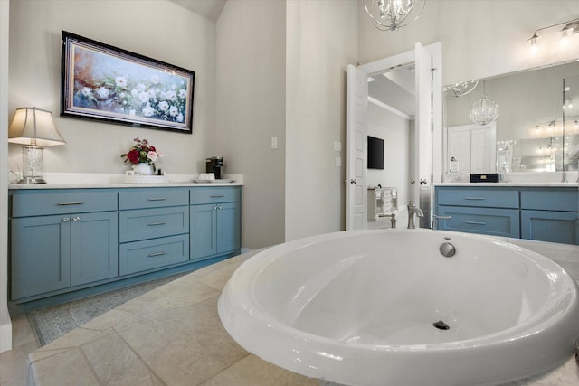 bathroom featuring a freestanding bath and vanity