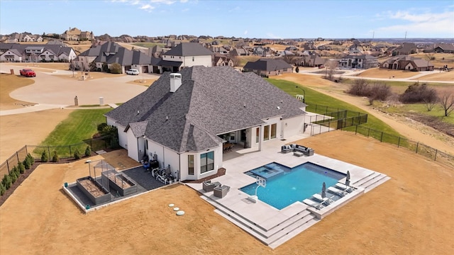 view of pool featuring a patio, a fenced backyard, a residential view, and a fenced in pool