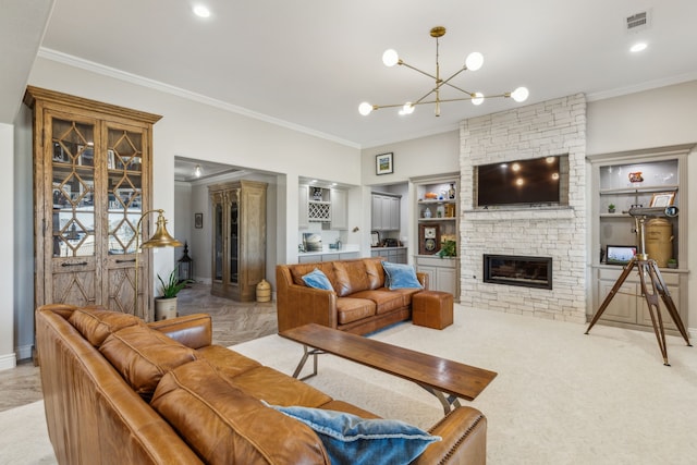 living room featuring a notable chandelier, built in shelves, a fireplace, and ornamental molding