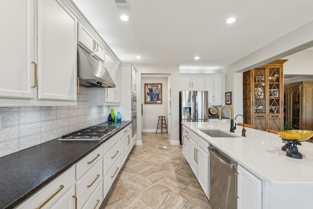 kitchen with appliances with stainless steel finishes, sink, and white cabinets