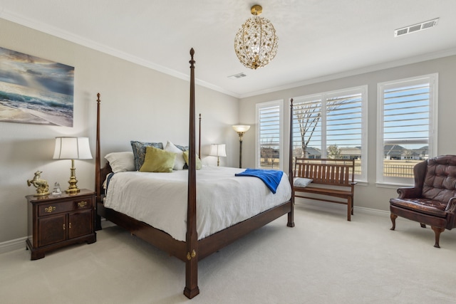 bedroom with ornamental molding and light colored carpet