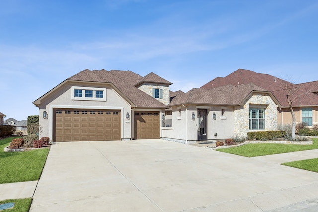 view of front facade with a garage and a front yard