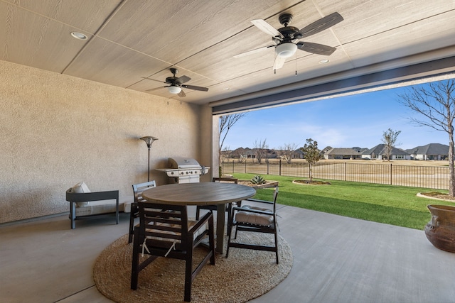 view of patio featuring area for grilling and ceiling fan