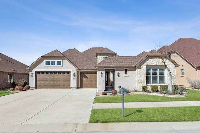 view of front of home featuring a garage and a front lawn