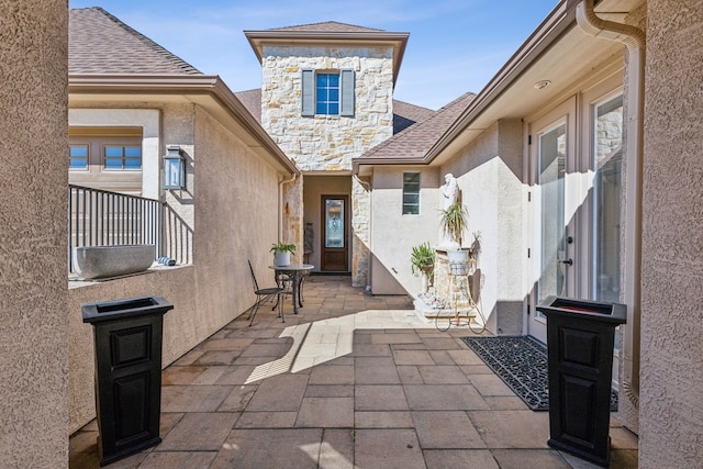 entrance to property with a patio area