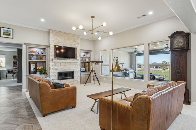 living room featuring ornamental molding, a stone fireplace, ceiling fan with notable chandelier, and light carpet