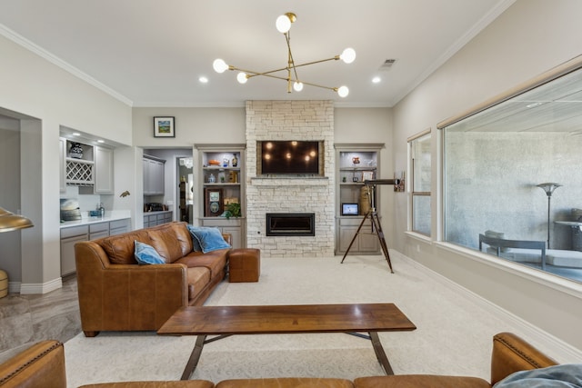 living room featuring an inviting chandelier, crown molding, bar, and a fireplace