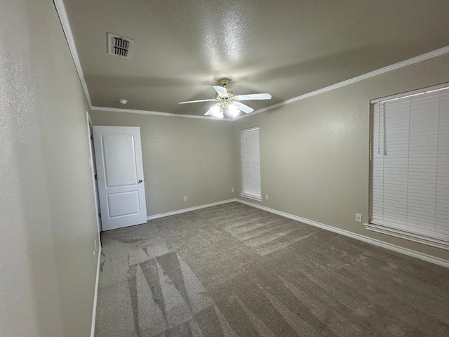 unfurnished bedroom featuring crown molding, carpet floors, and ceiling fan