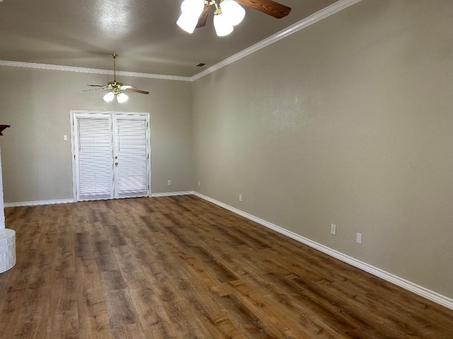 empty room featuring crown molding, ceiling fan, and dark hardwood / wood-style flooring