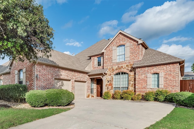 9328 Old Veranda Rd, Plano, TX 75024 - french provincial home with roof with shingles, brick siding, driveway, and an attached garage