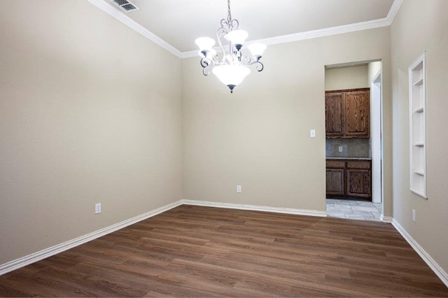 unfurnished room with crown molding, a notable chandelier, and dark hardwood / wood-style flooring