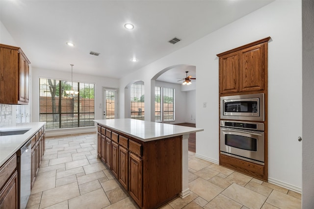 9328 Old Veranda Rd, Plano, TX 75024 - kitchen with stainless steel appliances, a chandelier, light countertops, a center island, and recessed lighting