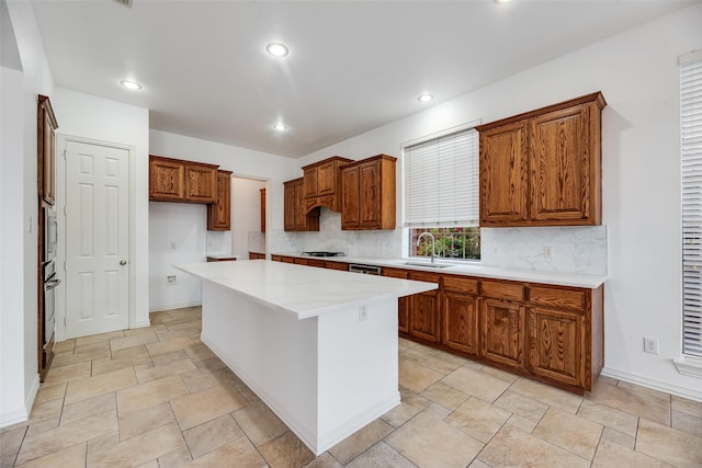 9328 Old Veranda Rd, Plano, TX 75024 - kitchen with gas cooktop, a sink, decorative backsplash, light countertops, and recessed lighting