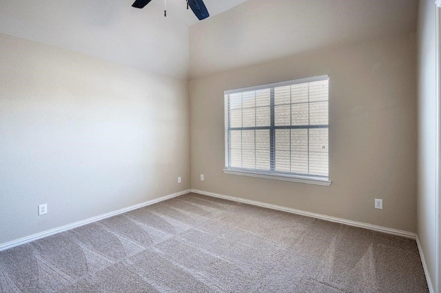 unfurnished room featuring vaulted ceiling, ceiling fan, and carpet flooring