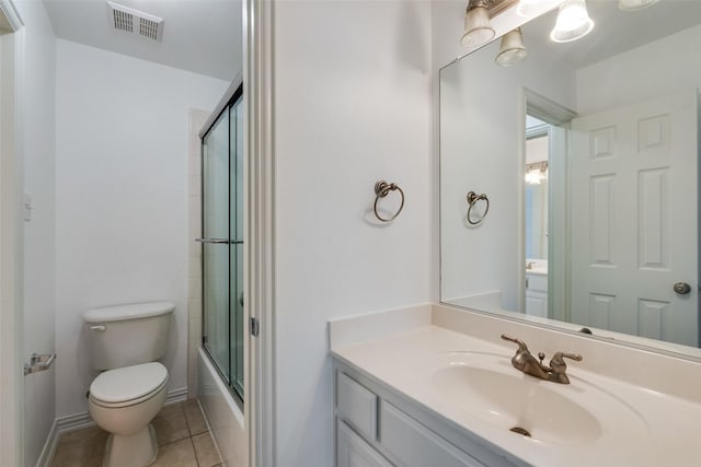9328 Old Veranda Rd, Plano, TX 75024 - full bathroom featuring vanity, toilet, tile patterned floors, bath / shower combo with glass door, and baseboards