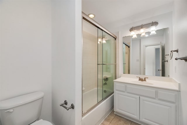 9328 Old Veranda Rd, Plano, TX 75024 - full bathroom featuring toilet, vanity, combined bath / shower with glass door, and tile patterned floors