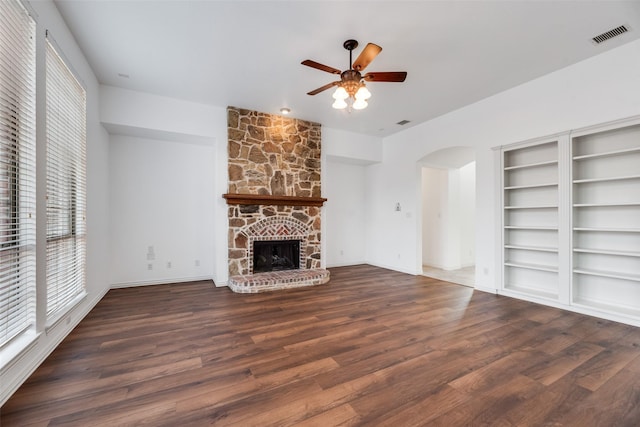 9328 Old Veranda Rd, Plano, TX 75024 - unfurnished living room with healthy amount of natural light, arched walkways, wood finished floors, and ceiling fan