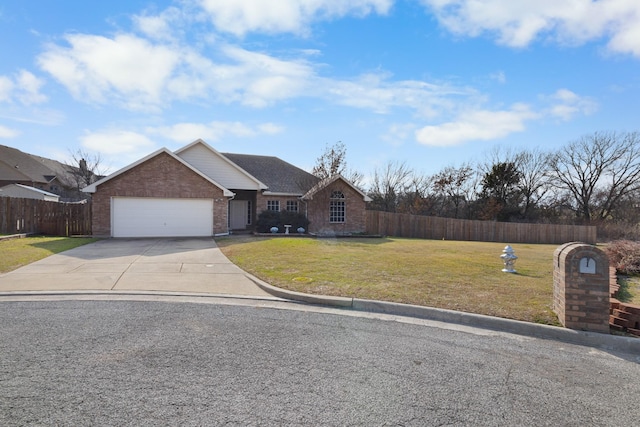 view of front facade featuring a garage and a front yard