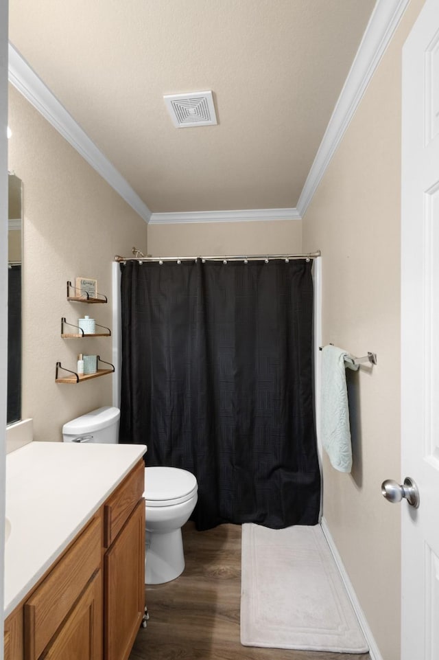 bathroom featuring crown molding, vanity, toilet, and hardwood / wood-style floors